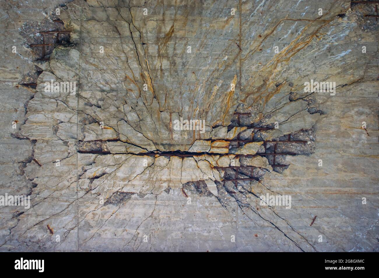 Crack in a concrete massive crack. Something exploded on the other side
