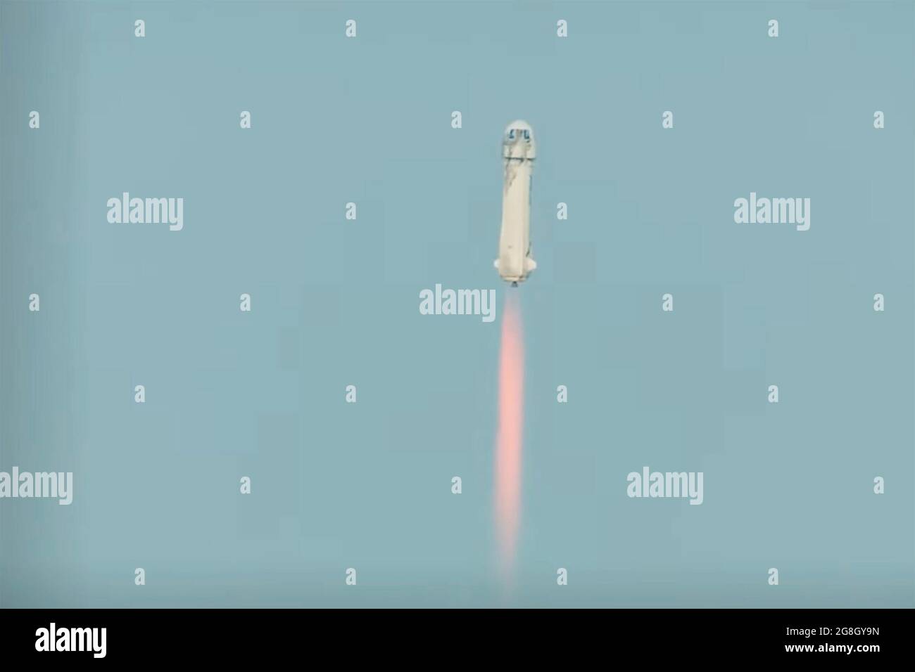 Texas, USA. 21st July, 2021. A screenshot taken from a live video released by Blue Origin on July 20, 2021 shows Blue Origin's spacecraft New Shepard rocket lifting off from its test site in Texas, the United States. U.S. aerospace company Blue Origin completed its first test spaceflight with founder Jeff Bezos onboard, marking a giant leap forward for the company's commercial suborbital spaceflight tourism ambitions. (Blue Origin/Handout via Xinhua) Credit: Xinhua/Alamy Live News Stock Photo