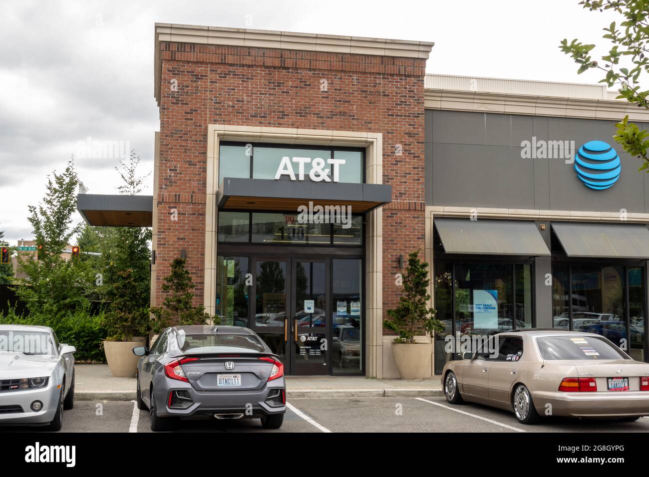 Kirkland, WA USA - circa July 2021: Exterior view of an AT&T retail store in Totem Lake on an overcast day. Stock Photo