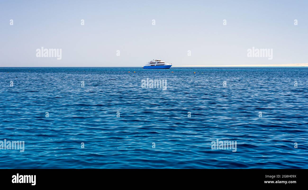 one pleasure boat in the blue water of the Red Sea in Egypt Stock Photo ...