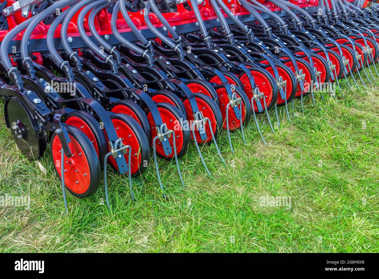 Russia, Leningrad Region - June, 2019: Working bodies of equipment for sowing seeds. Agricultural machinery, seed drill Stock Photo