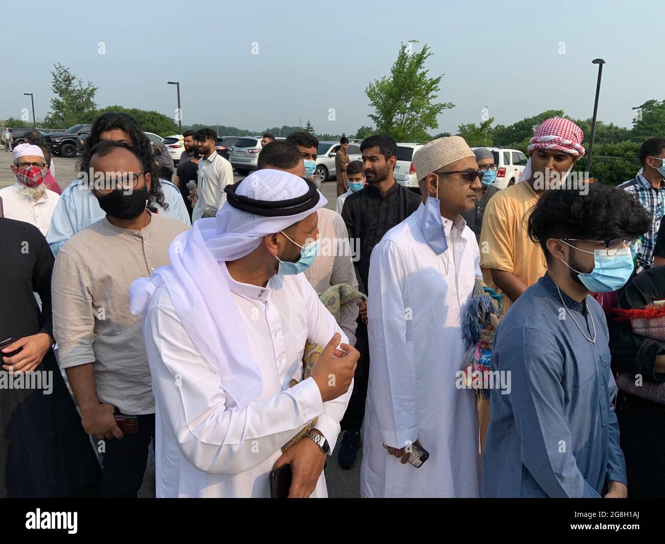 A crowd Muslim worshippers gather outdoor at the mosque to worship and celebrate Eid festival. Stock Photo