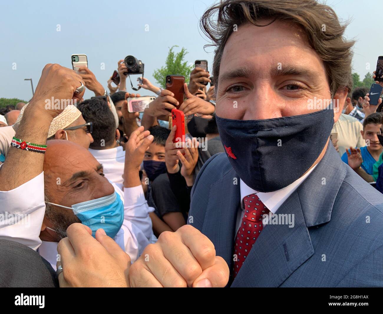 HAMILTON, Ontario, Canada - July 2021: Justin Trudeau caught in th mids of a thick crowd outside the Hamilton Mountain mosque. Stock Photo
