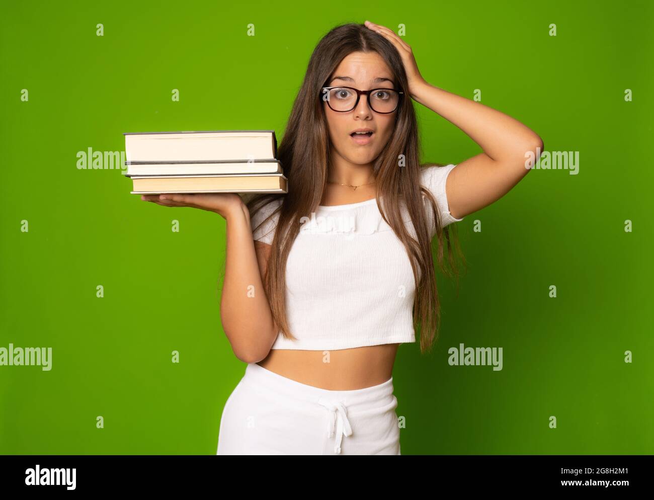 Portrait of attractive cute young student girl holding books Stock ...