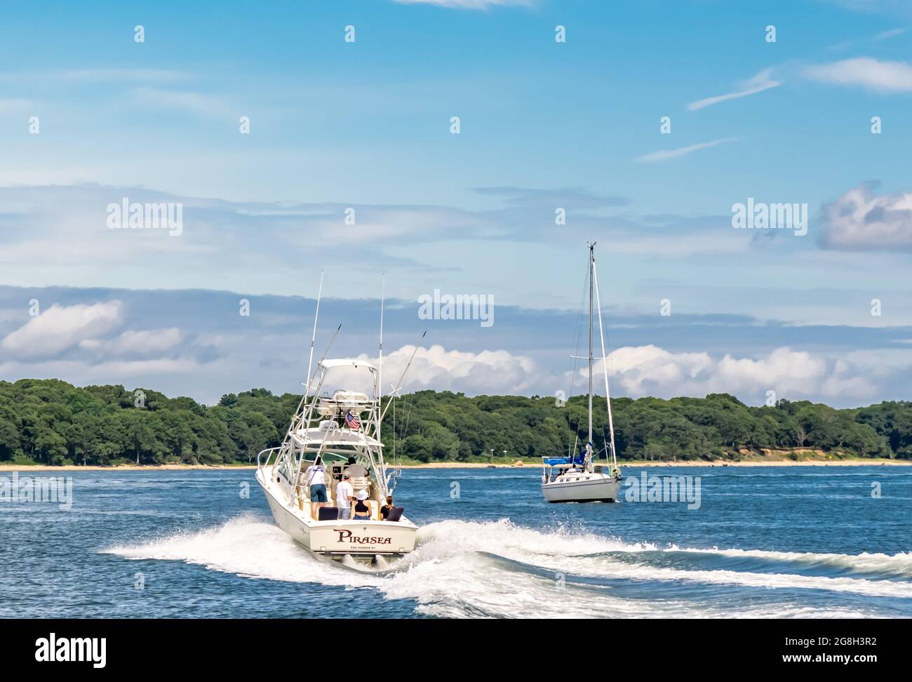 Fishing boat passing a sail boat off Shelter Island, NY Stock Photo Alamy