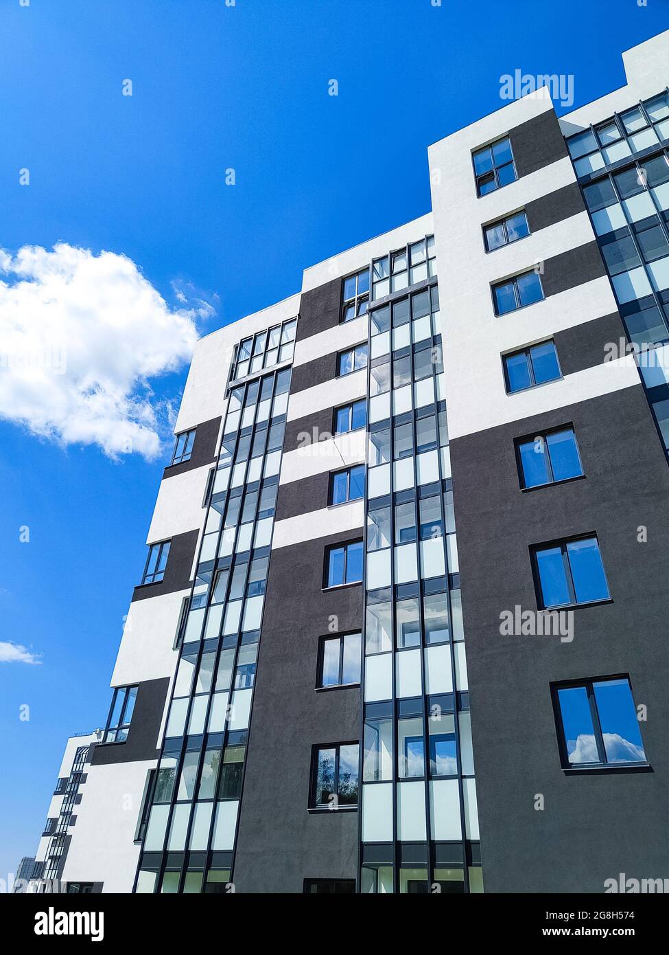 Fragment of modern apartment building opposite blue sky Stock Photo Alamy