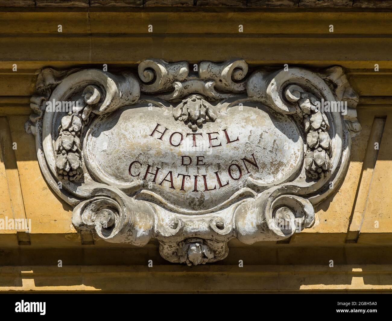 Sign above doorway of 17th century Hotel de Chatillon (historical building), rue de Peyenne, Paris, France. Stock Photo