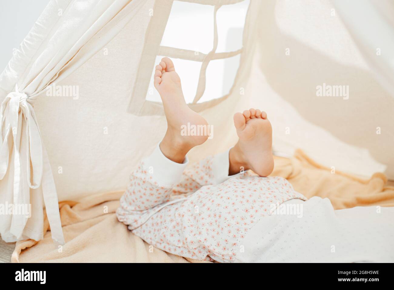 Child girl feet in teepee Stock Photo