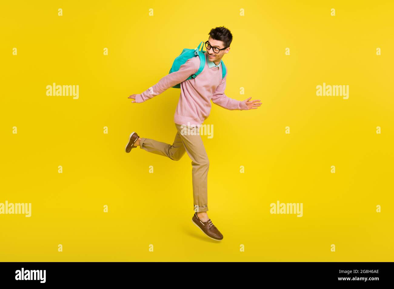 Full size photo of young man happy positive smile go walk run jump up ...