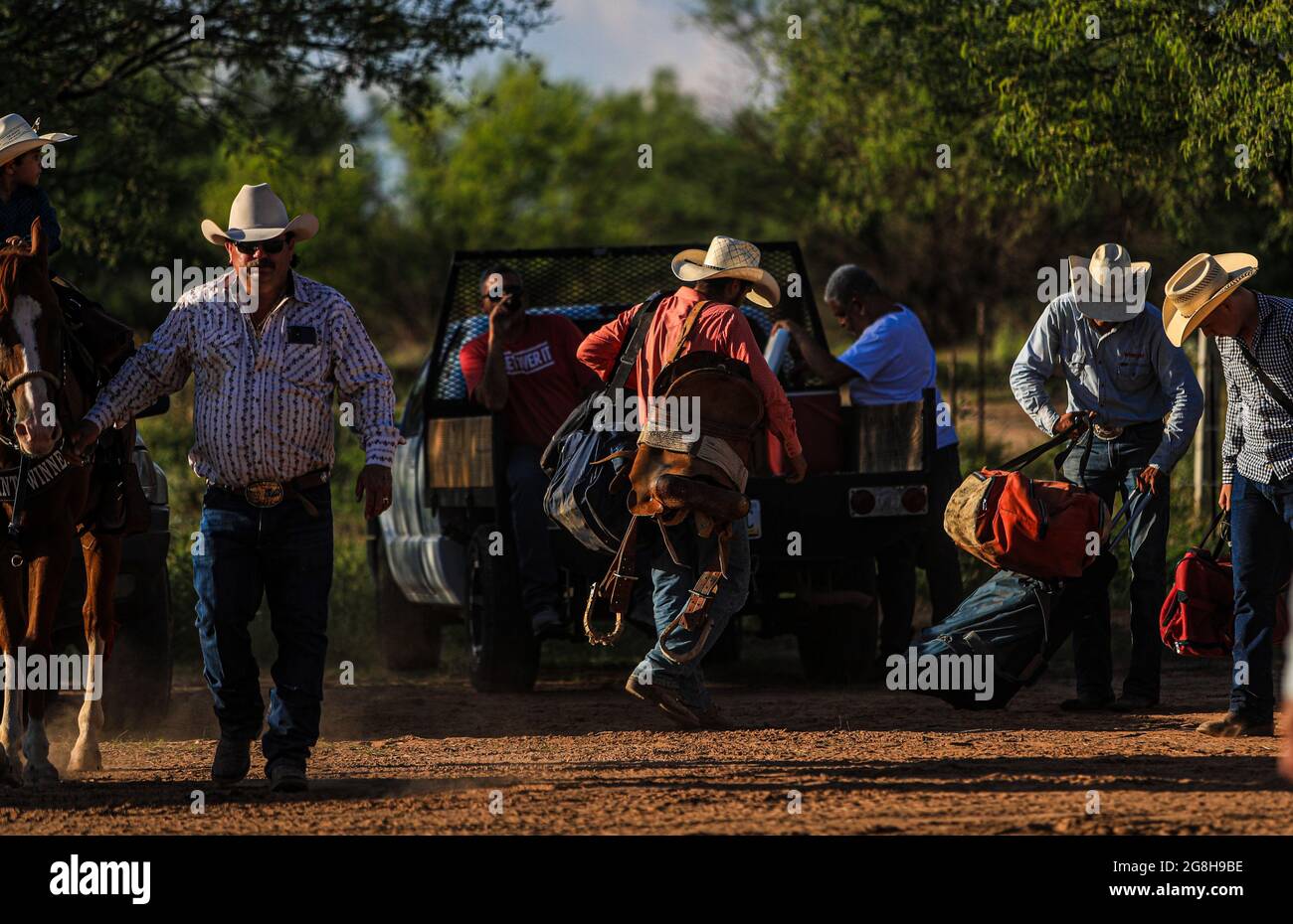 Arrival of cowboy competitors and riders with their suitcases at sunset,  during the rodeo circuit in the new arena El Shejon with the participation  of the brands Corona Buckles, Sonora Saddlery and