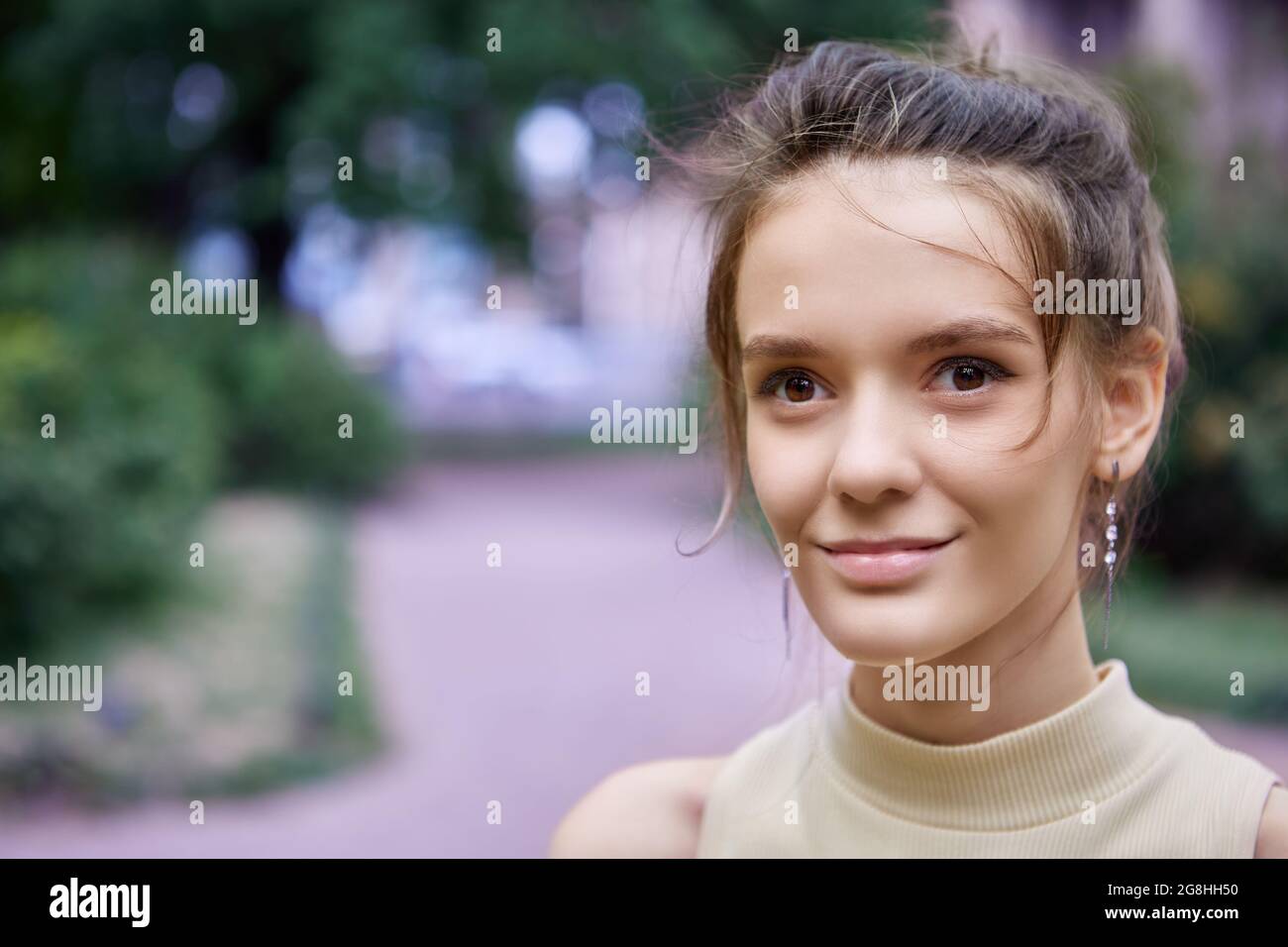 Close-up of cross-eyed woman sticking out tongue stock photo