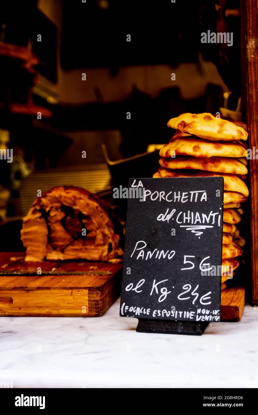 Roast Pork known as Porchetta in Italy displayed for sale with Panini Bologna Italy Stock Photo