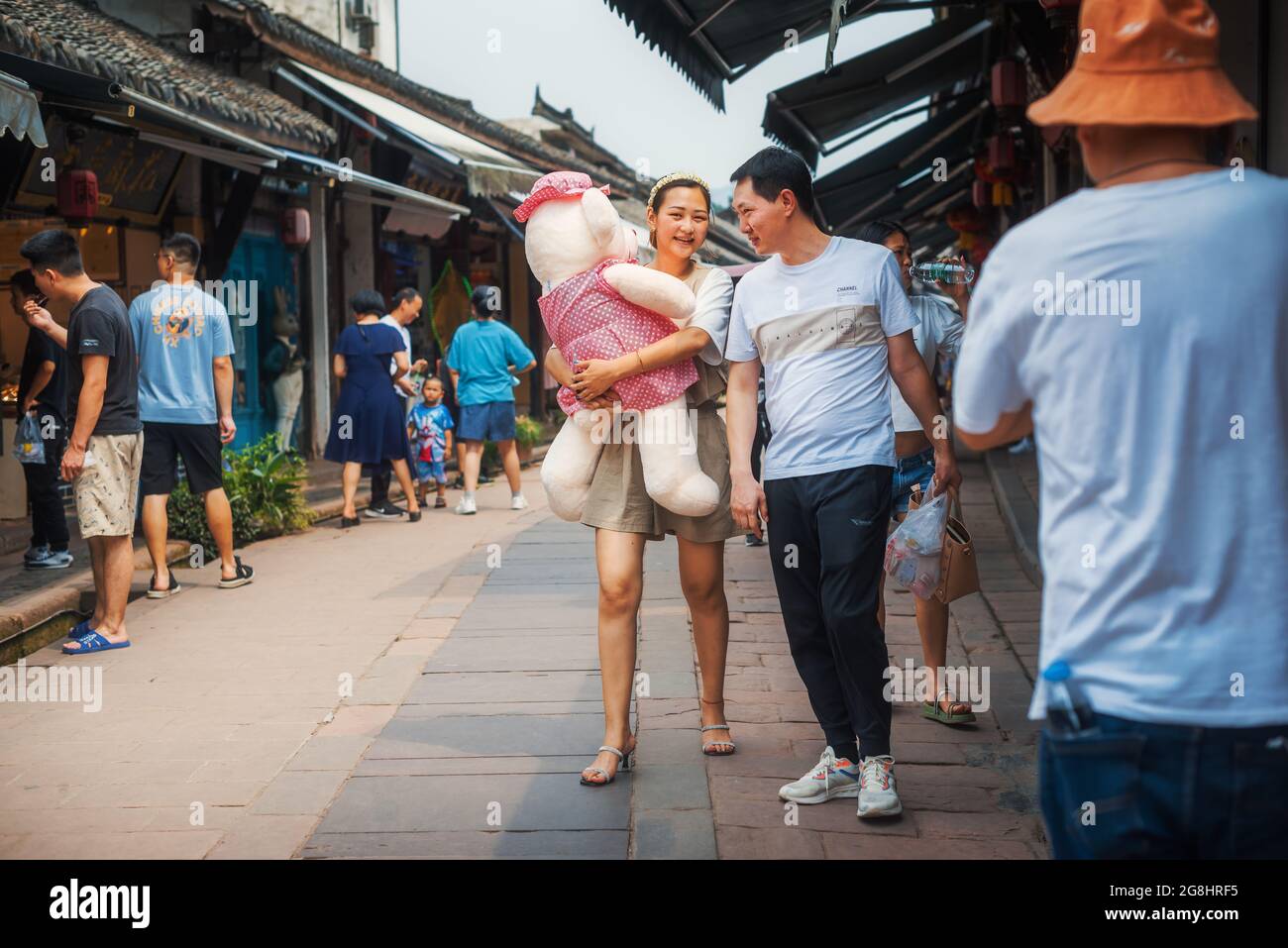 Luodai, Chengdu, Sichuan province, China - June 27, 2021 : Chinese tourists enjoying their time in the ancient city. Stock Photo