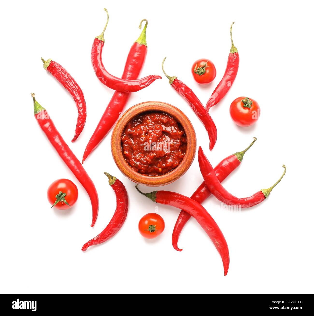 Bowl of chili sauce on white background Stock Photo