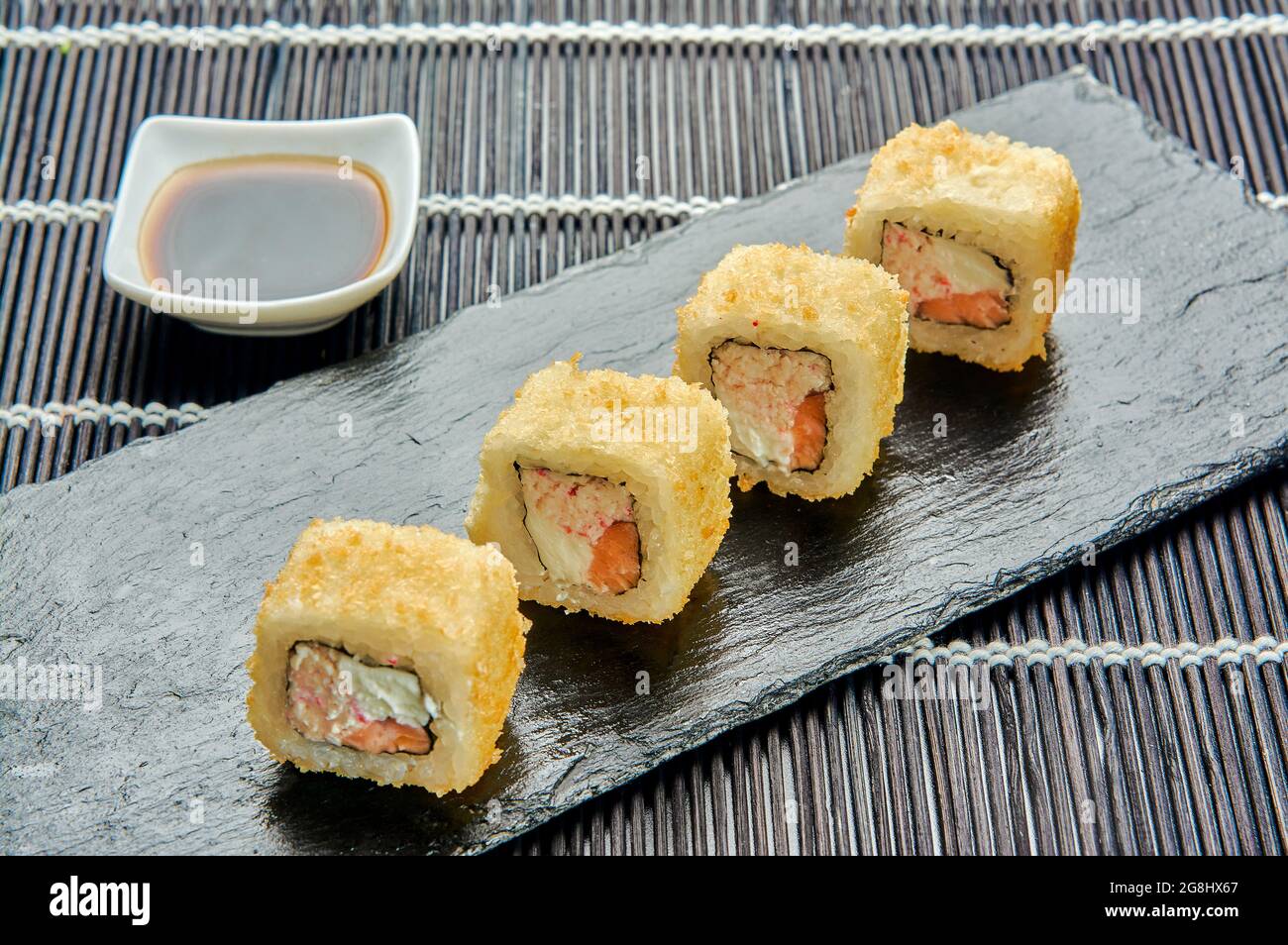 syake hot rolls on a stone stand, Japanese cuisine Stock Photo