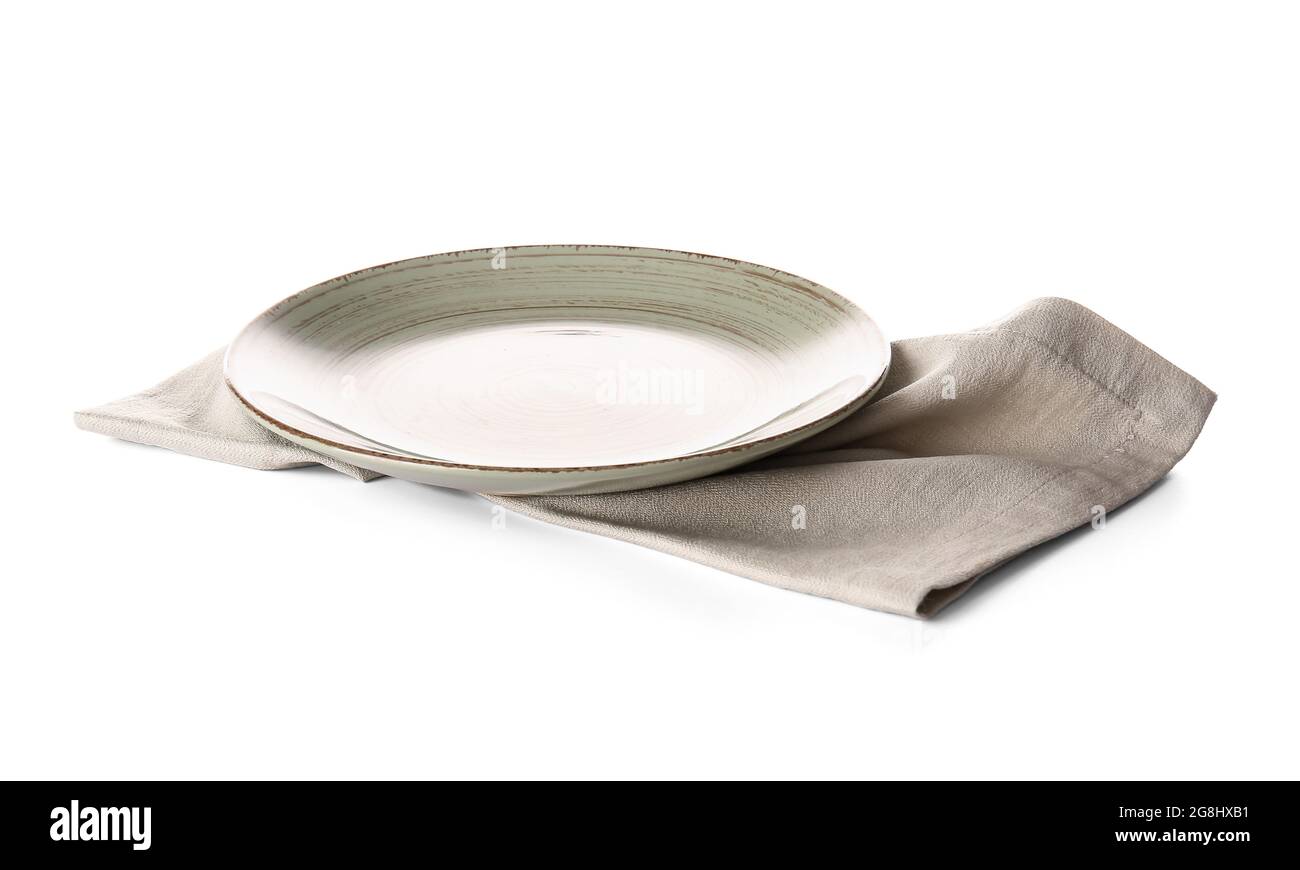 Fabric napkin and plate on white background Stock Photo - Alamy