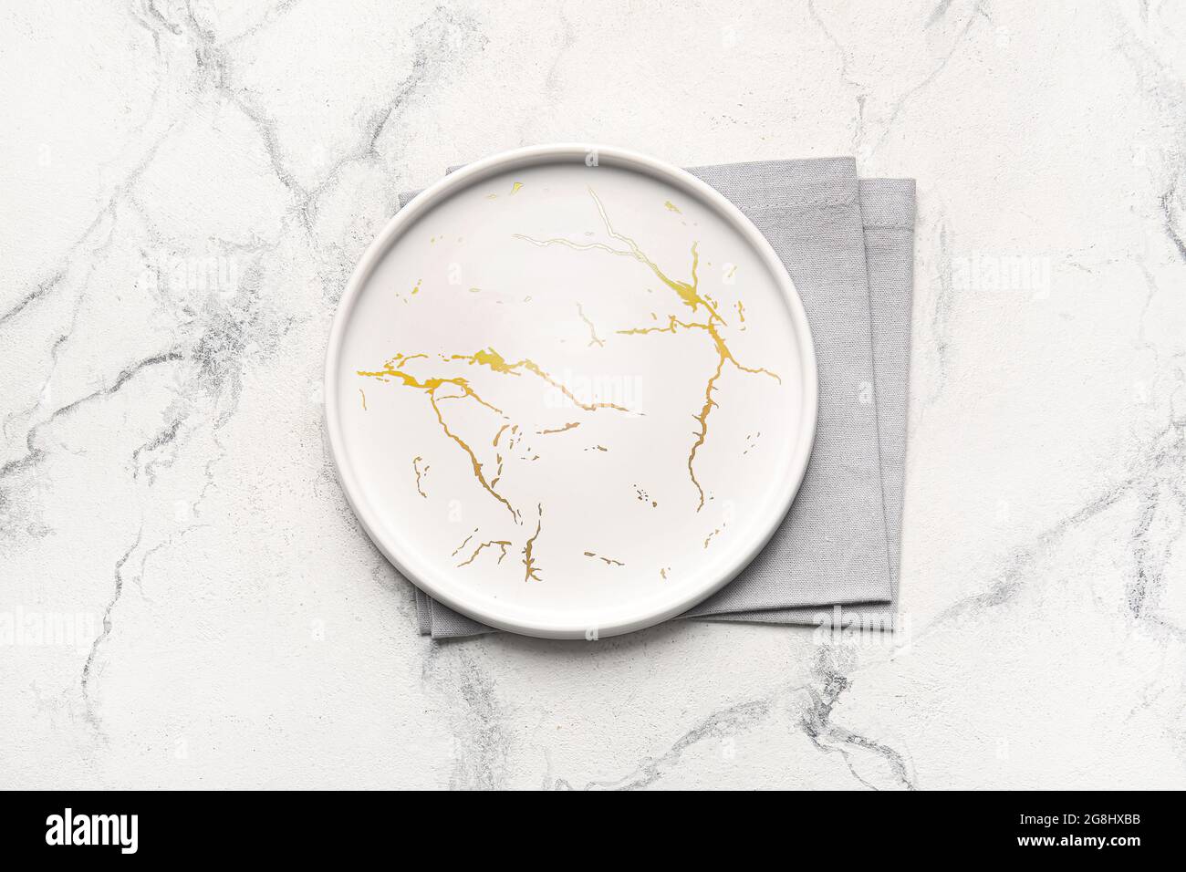 Fabric napkins and plate on light background Stock Photo