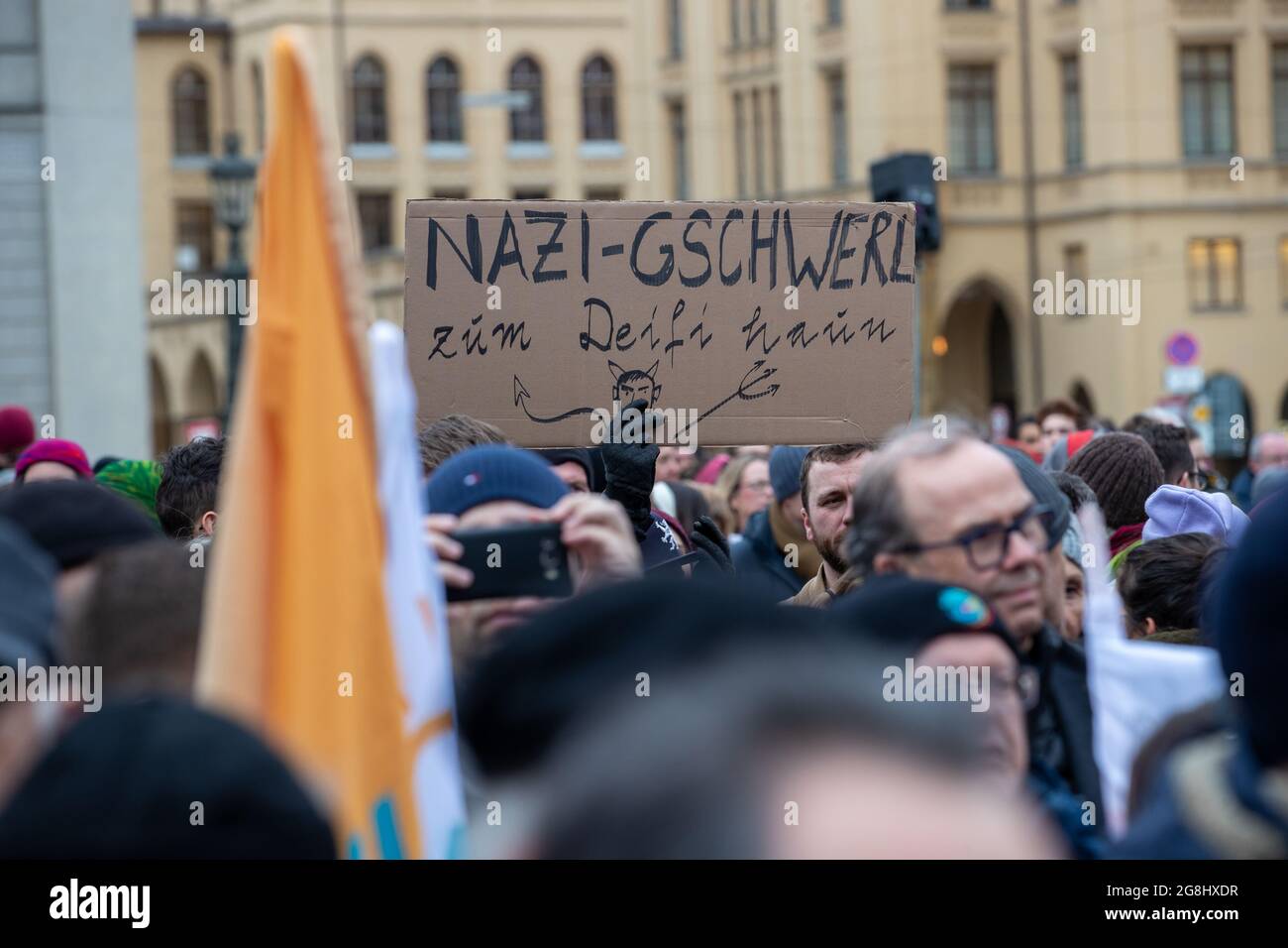 Munich, Germany. 06th Mar, 2020. Sign in Bavarian reading ' Chase the Nazi scum to the devil ' at the antifascist protest ' Just don't do it ' organized by Bellevue di Monaco on 6. March 2020 at the Max-Josef-Platz in Munich. (Photo by Alexander Pohl/Sipa USA) Credit: Sipa USA/Alamy Live News Stock Photo