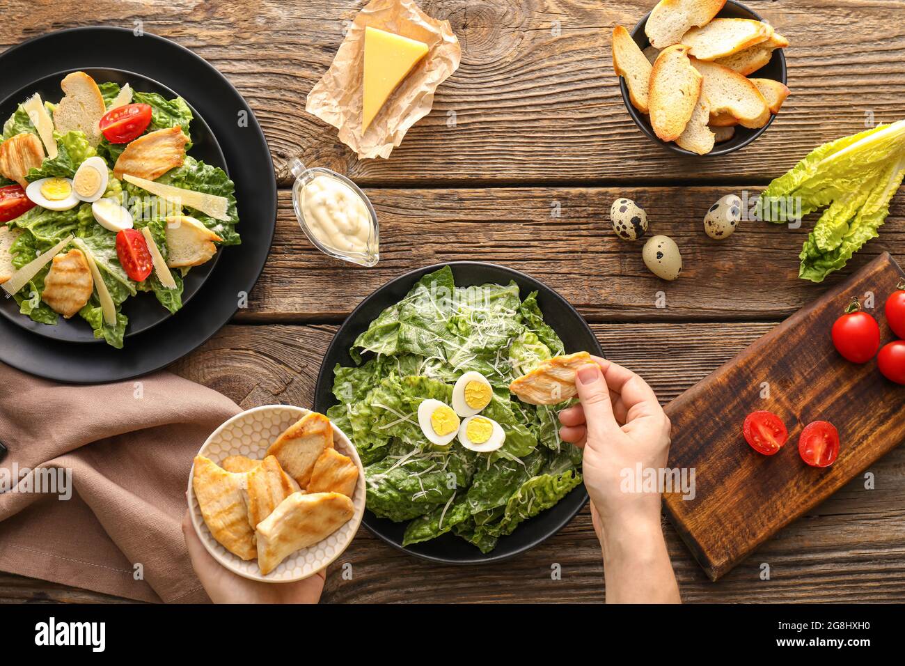Woman dressing tasty caesar hi-res stock photography and images - Alamy