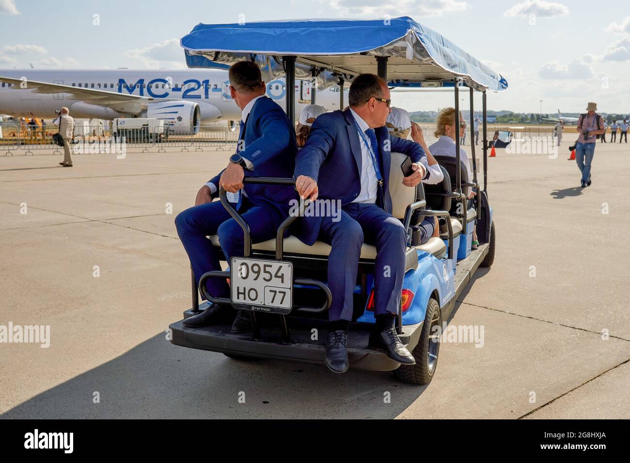 Zhukovsky, Russia. 20th July, 2021. Visitors on an electric vehicle during the work of the XV International Aviation and Space Salon MAKS-2021 that was opened by the President of the Russian Federation, Vladimir Putin. MAKS (International Air and Space Salon) is a biennial international air show held at Zhukovsky International Airport and is a traditional marketplace for Russian defence and commercial aerospace industry. (Photo by Mihail Siergiejevicz/SOPA Imag/Sipa USA) Credit: Sipa USA/Alamy Live News Stock Photo