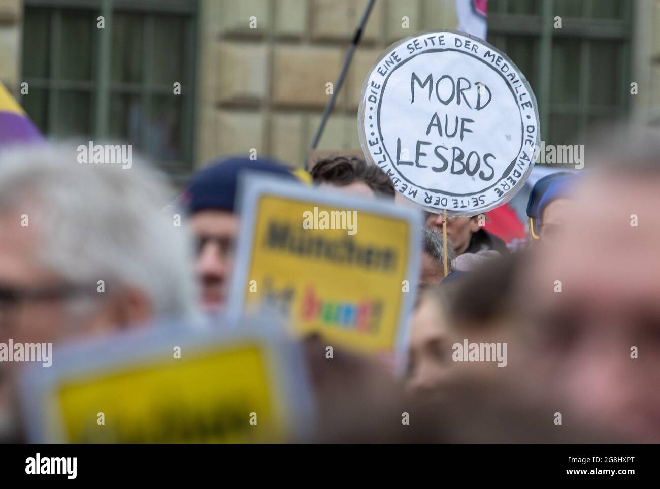 Munich, Germany. 06th Mar, 2020. Sign reading ' Murder in Lesvos ' at the antifascist protest ' Just don't do it ' organized by Bellevue di Monaco on 6. March 2020 at the Max-Josef-Platz in Munich. (Photo by Alexander Pohl/Sipa USA) Credit: Sipa USA/Alamy Live News Stock Photo