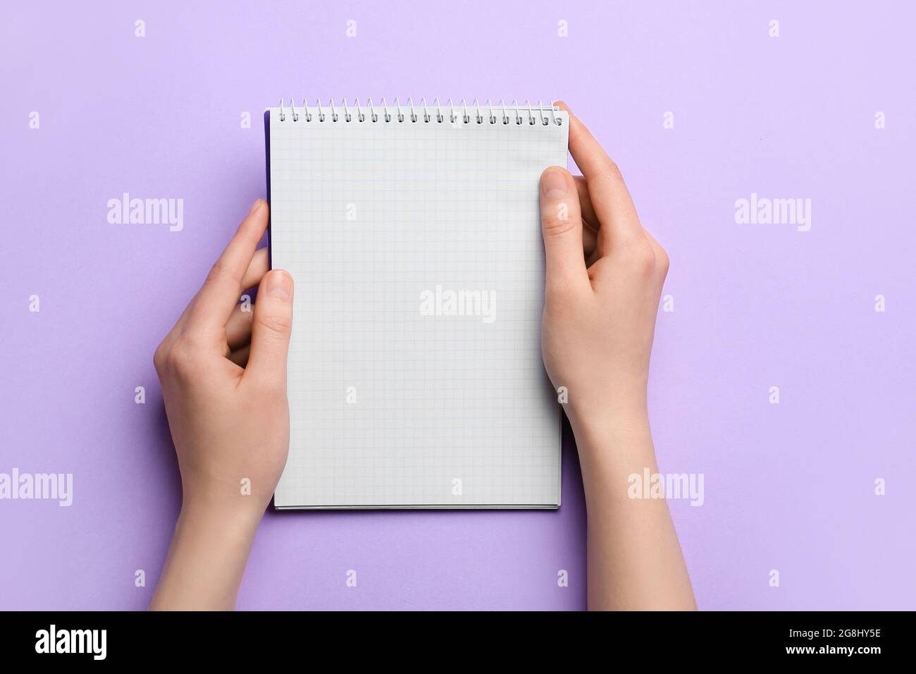 Woman holding blank notebook on color background, closeup Stock Photo ...