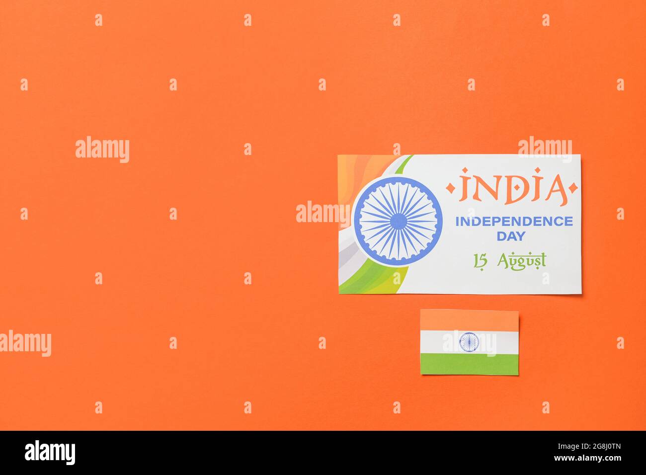 Indian flag and greeting card for Independence Day on color background ...