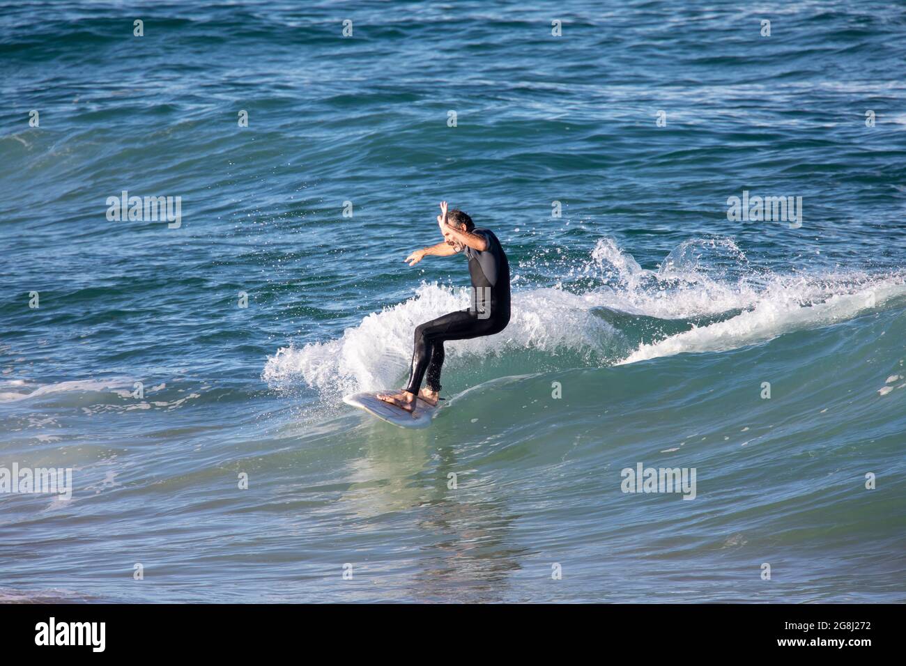 Man wearing a wetsuit hi-res stock photography and images - Alamy
