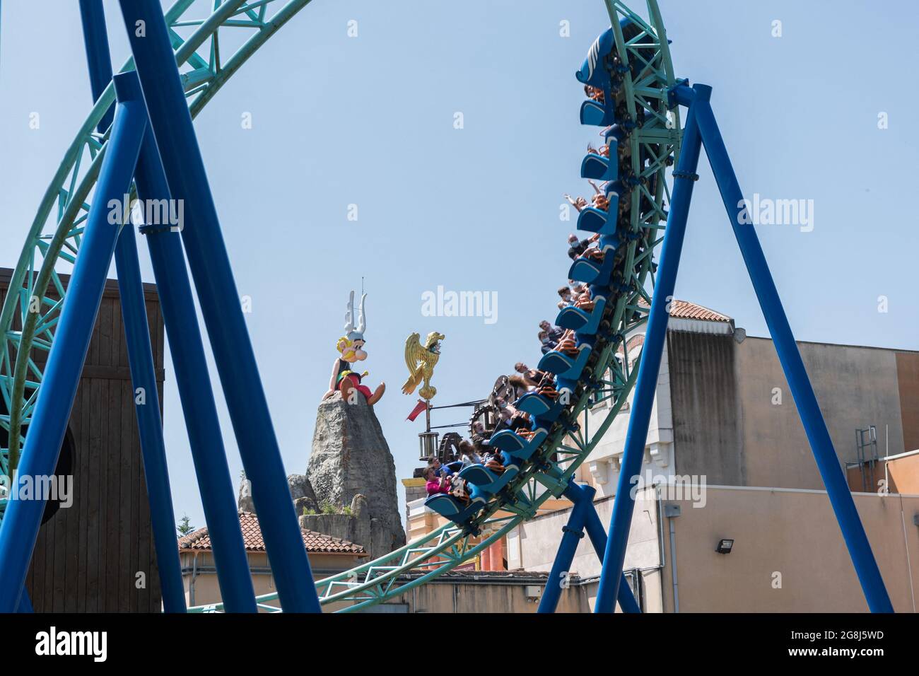 Visitors ride a rollercoaster under the statue of Asterix at the Parc  Asterix, a theme Park dedicated to the Gaulish warrior of comic strips, as  new measures are taken to limit the