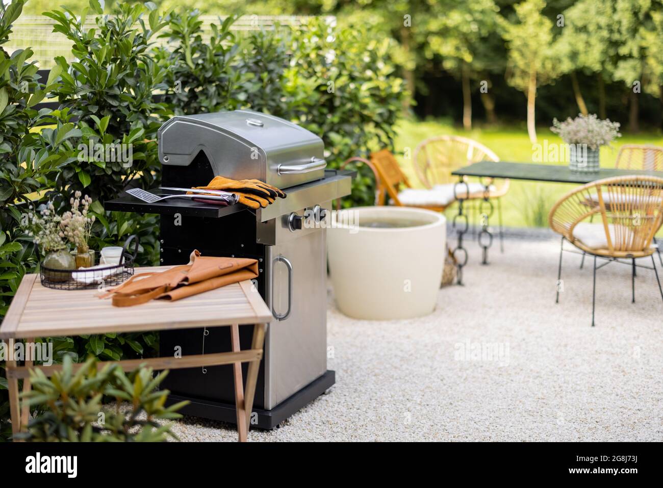 Backyard with barbeque and dining table Stock Photo Alamy