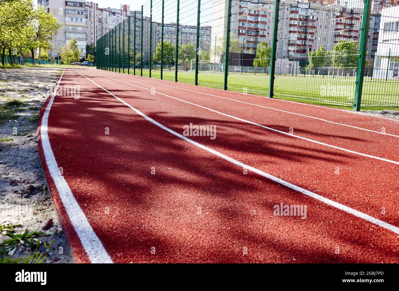 Red treadmill on sport field. Running track on the stadium Stock Photo Alamy