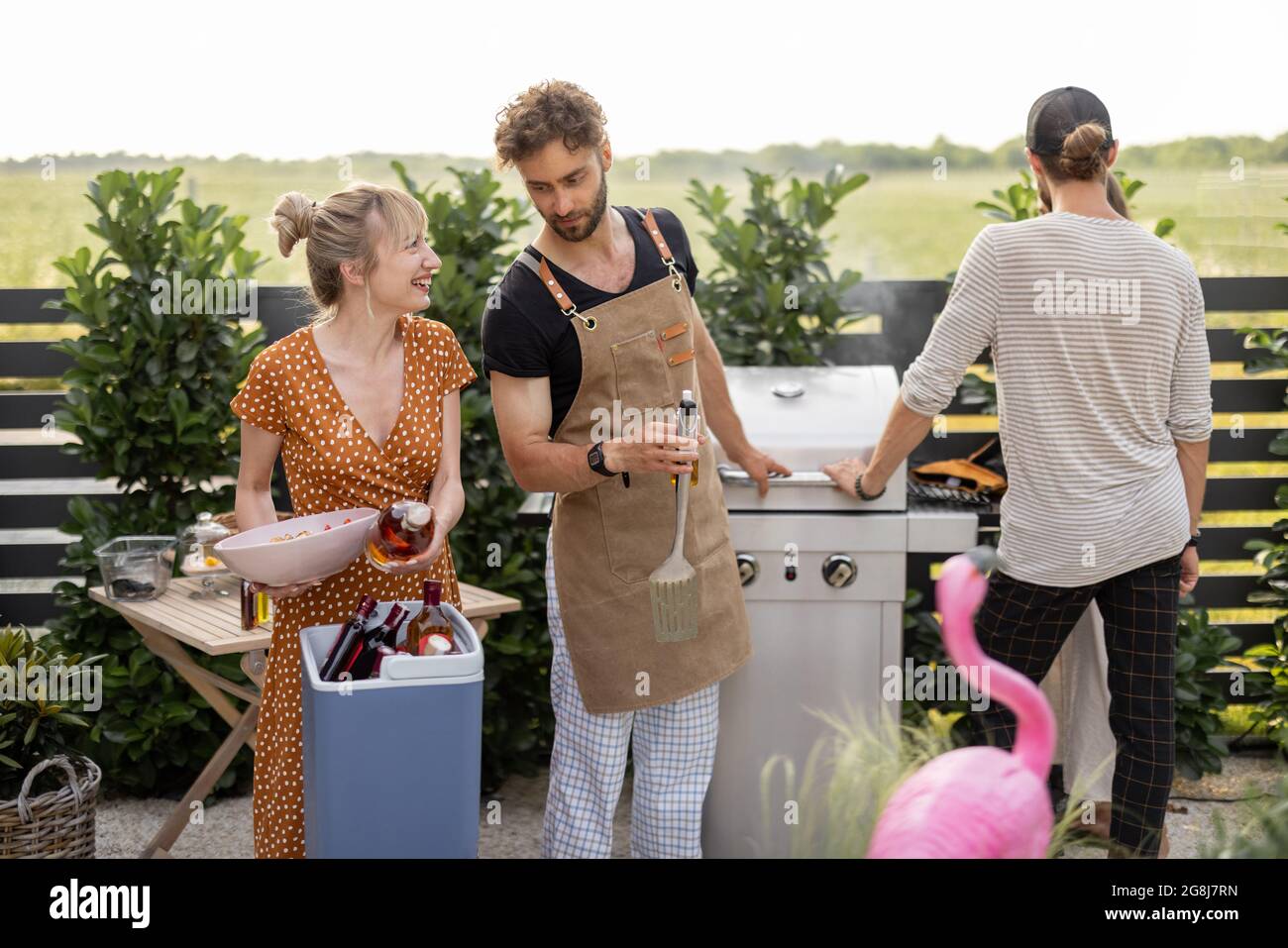 Friends with food and alcohol at backyard on a picnic Stock Photo Alamy