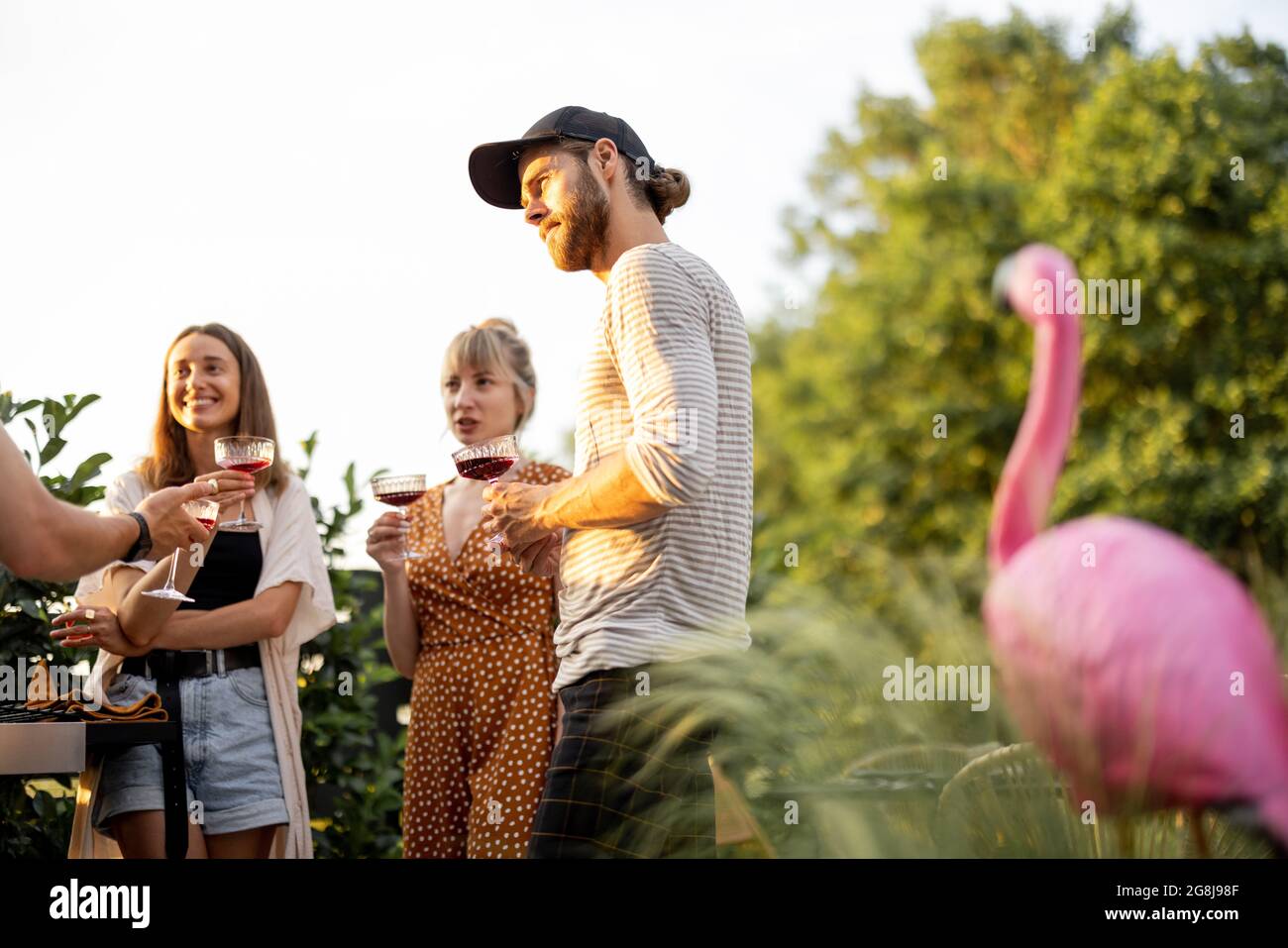Friends having fun at picnic outdoors Stock Photo