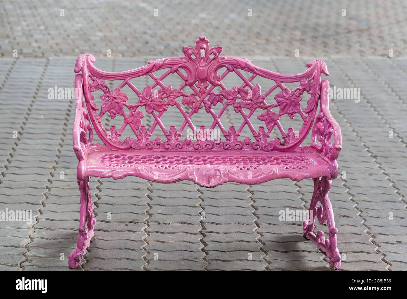 Pink metal vintage chair on brick floor Stock Photo Alamy