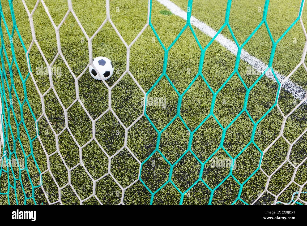 Soccer ball in the goal for background Stock Photo - Alamy