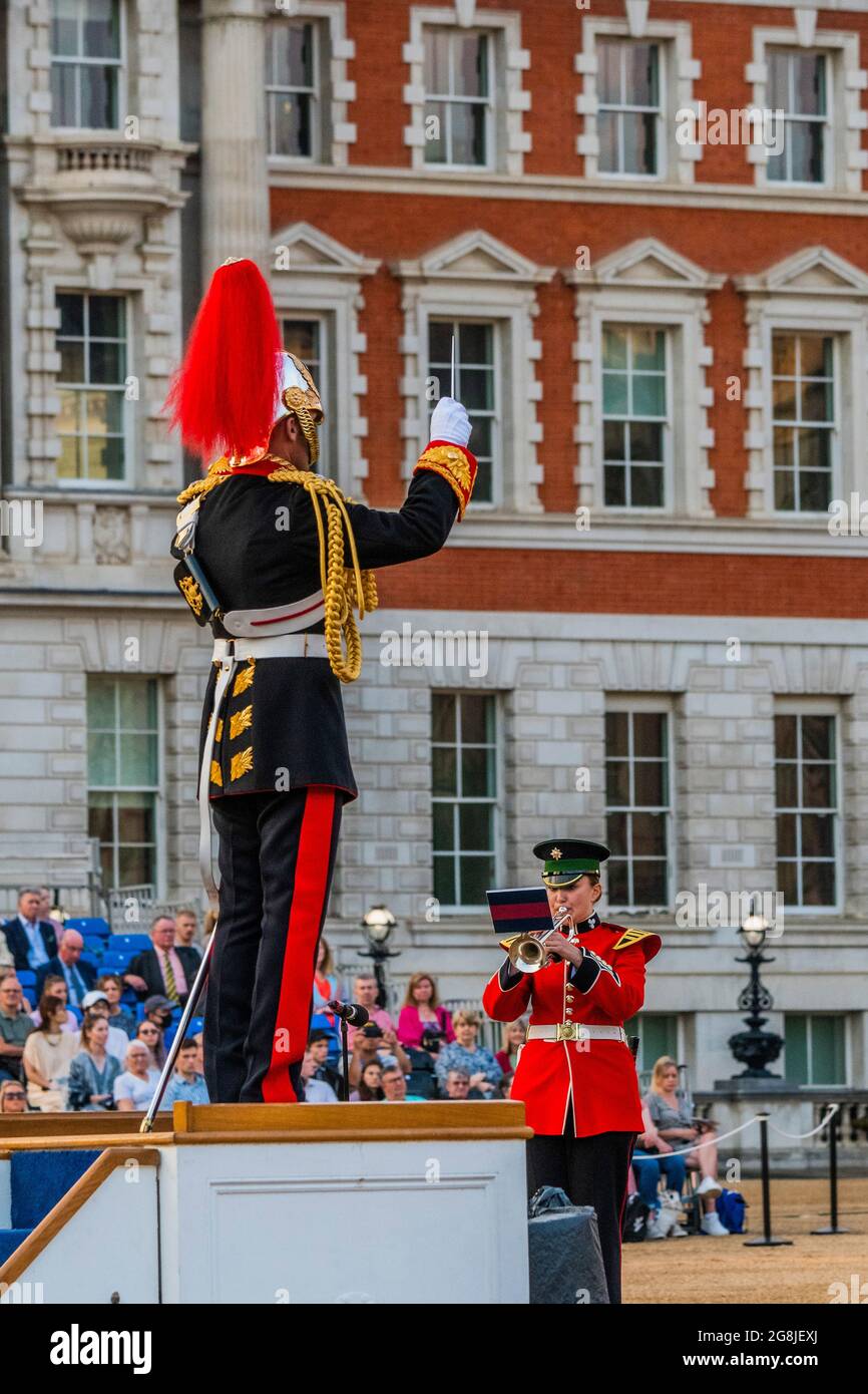 London, UK. 20th July, 2021. Musn Anna Kucharczack joint winner of the Household Division Musician of the Year - Members of the bands of the Grenadier, Coldstream, Scots, Irish and Welsh Guards and representatives from the 1st Battalion Grenadier Corps of Drums perform The Sword & The Crown which includes arrangements by members of the band and an interpretation of the music usually associated with secret agent James Bond. The first night of the performances which take place on 20/21/22 July on Horse Guards Parade. Credit: Guy Bell/Alamy Live News Stock Photo