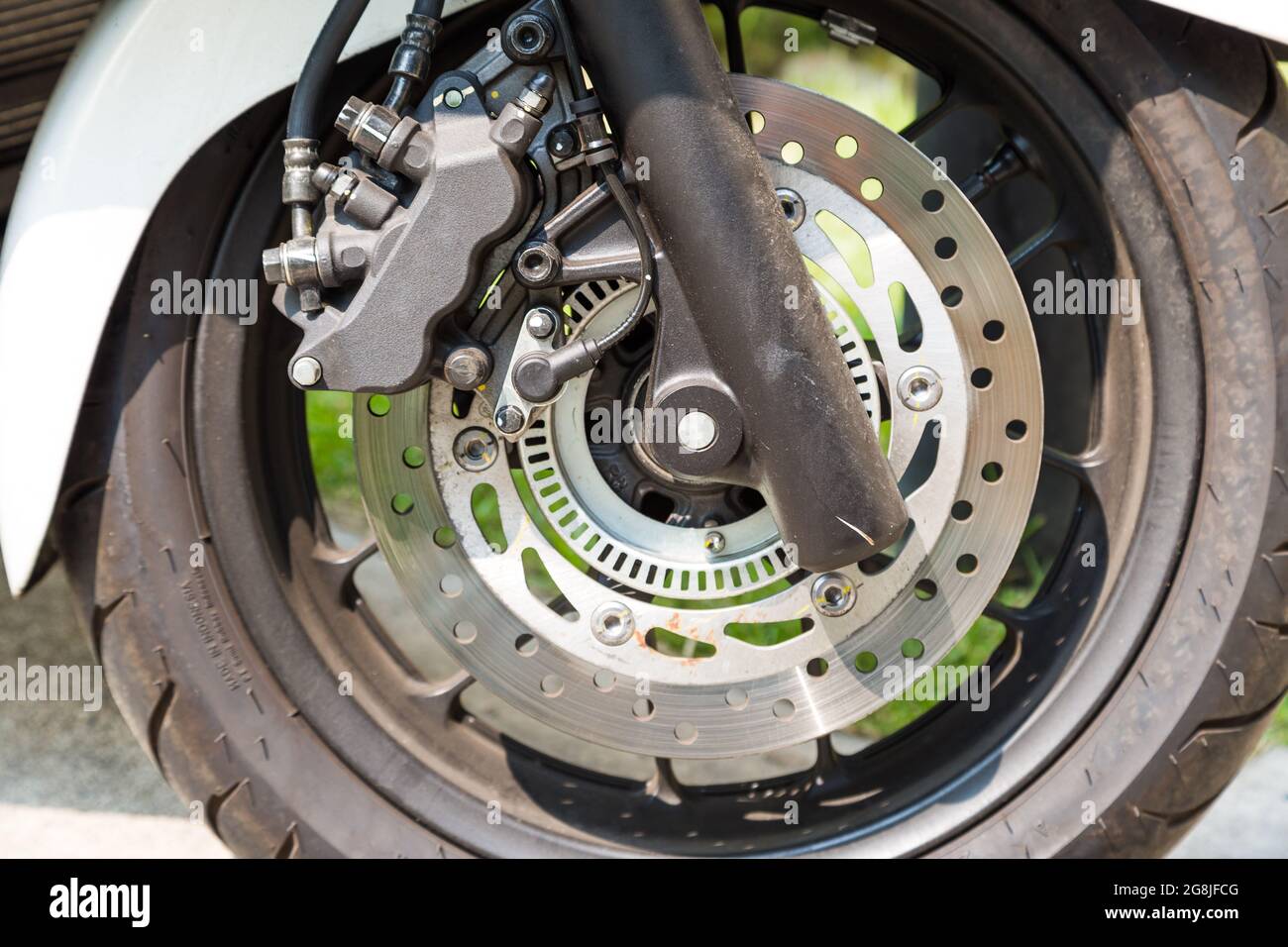Disc brake of eco motorcycle, , scooter motorcycle background Stock
