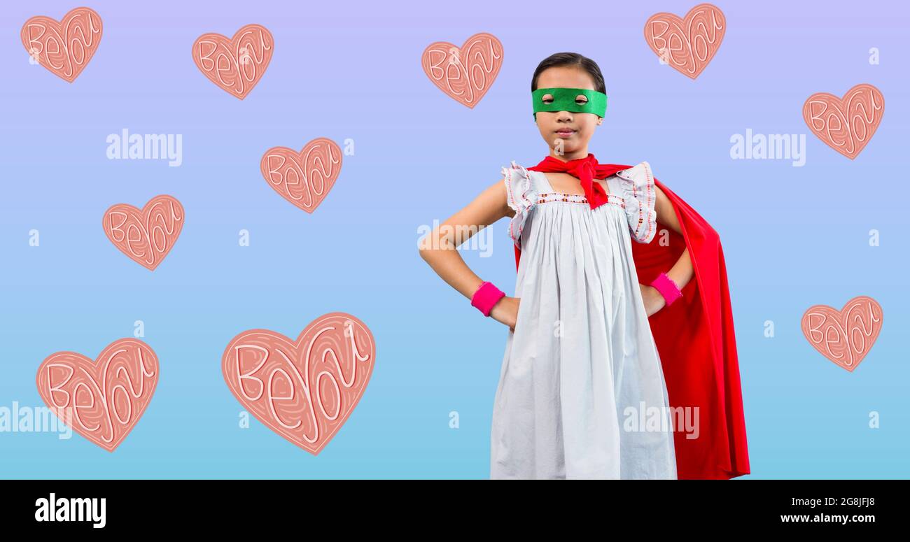 Composition of girl power text over girl in superhero costume Stock Photo