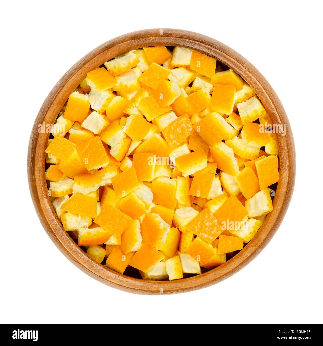 Fresh organic orange skin, cut in square shaped pieces, in a wooden bowl. Square cut skin of oranges, used for baking, or dried for tea blends. Stock Photo