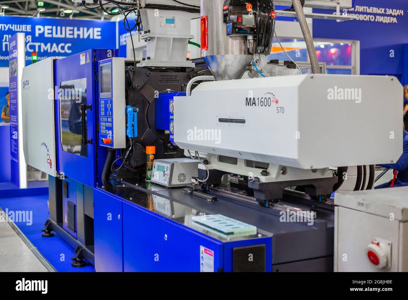 Electric hydraulic injection molding machine at plastic exhibition Stock Photo Alamy