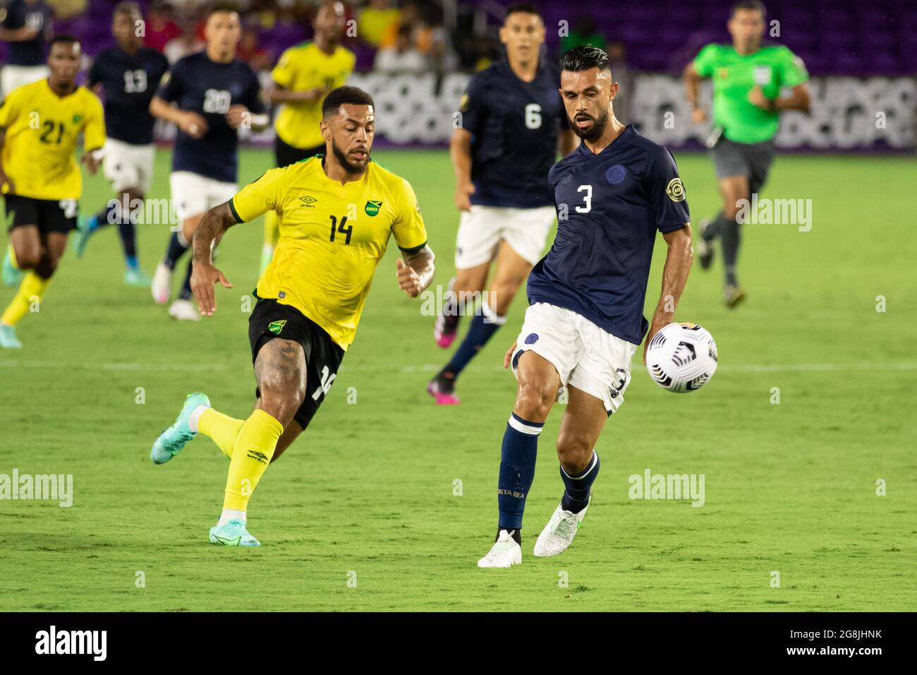 Orlando, United States. 21st July, 2021. Giancarlo Gonzalez (3 Costa Rica) passes the ball back to the goal keeper before Andre Gray (14 Jamaica) could intercept during the CONCACAF Gold Cup game between Costa Rica and Jamaica at Exploria Stadium in Orlando, Florida. NO COMMERCIAL USAGE. Credit: SPP Sport Press Photo. /Alamy Live News Stock Photo