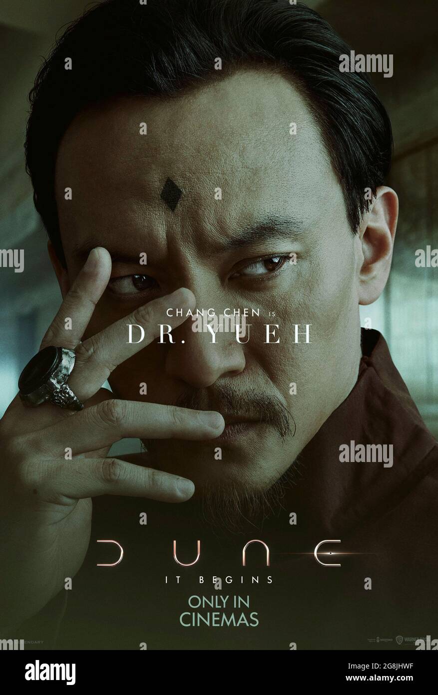 Dune (2021) directed by Denis Villeneuve and starring Chen Chang as Dr Yueh. Big screen adaptation of Frank Herbert's sci-fi masterpiece about the coming of a prophesied Messiah who will lead the Fremen and take control of Arrakis and the spice that enables long distance travel through space. Stock Photo
