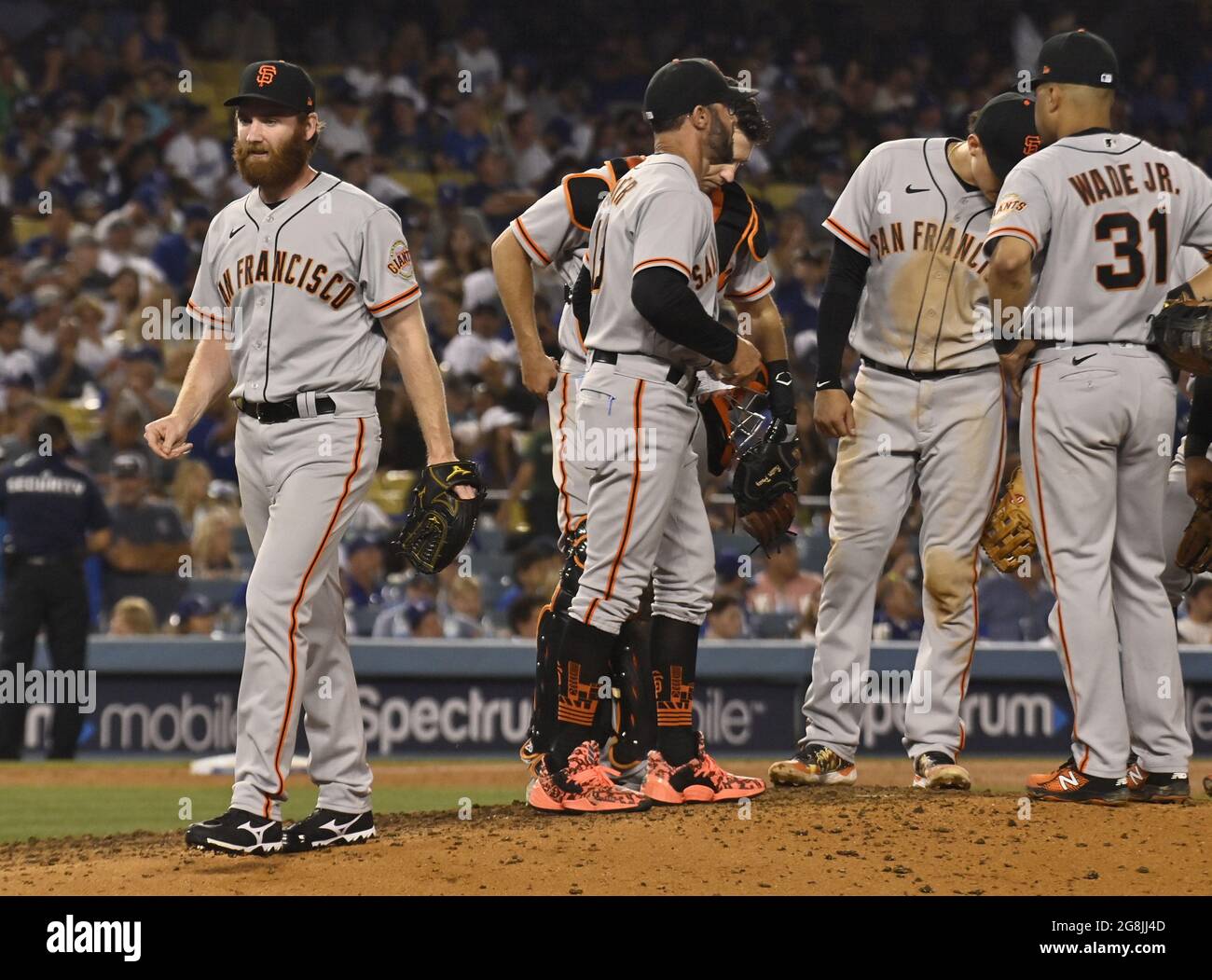 July 18, 2011; San Francisco, CA, USA; A San Francisco Giants fan holds up  a sign that reads beat LA during the ninth inning against the Los Angeles  Dodgers at AT&T Park.