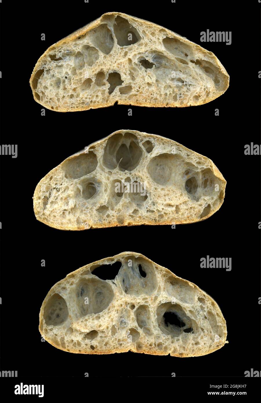 Three slices of sourdough bread on a black background showing internal structure Stock Photo Alamy
