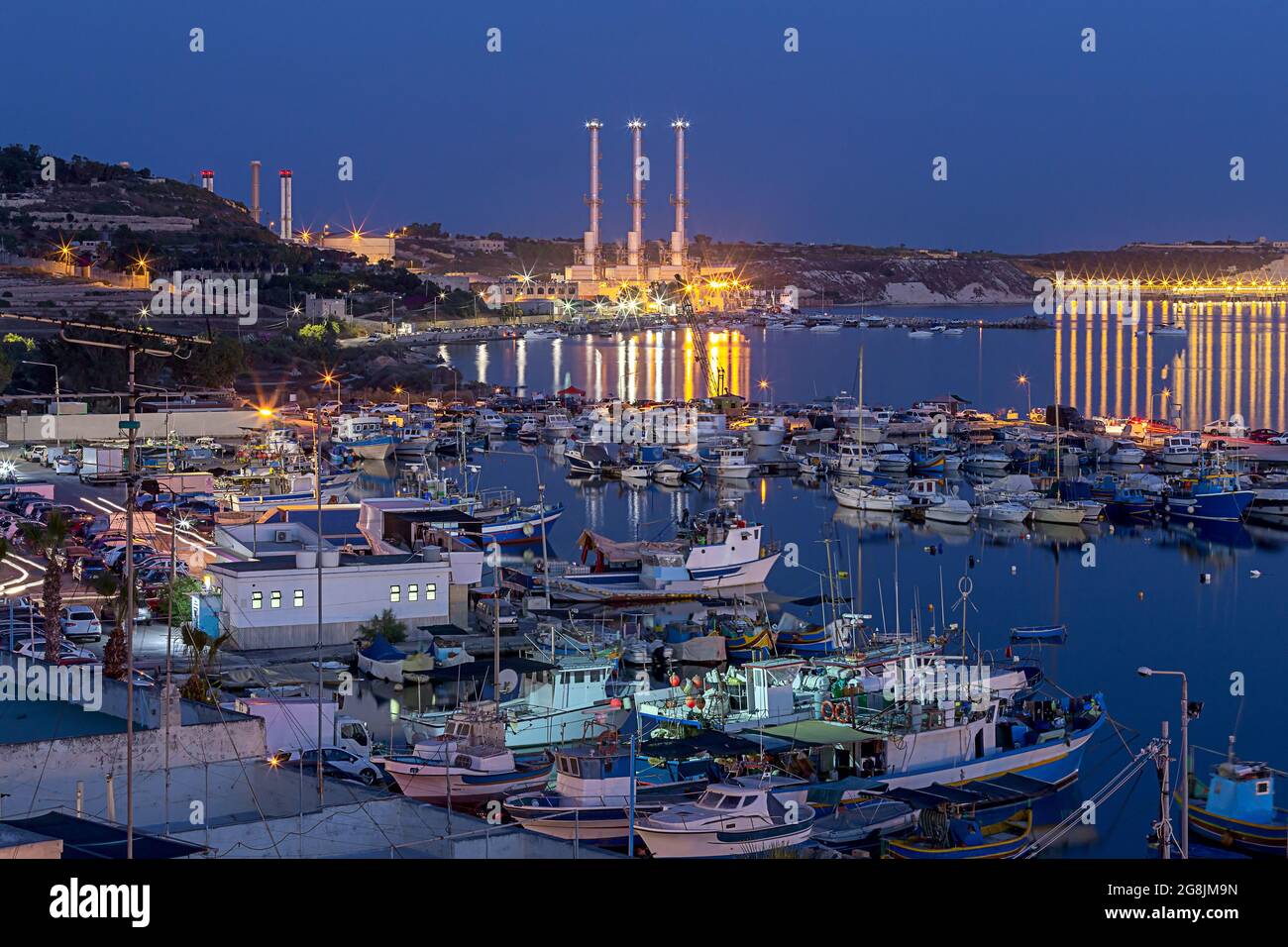 Marsaxlokk. Traditional boats Luzzu in the old harbor at sunset Stock ...