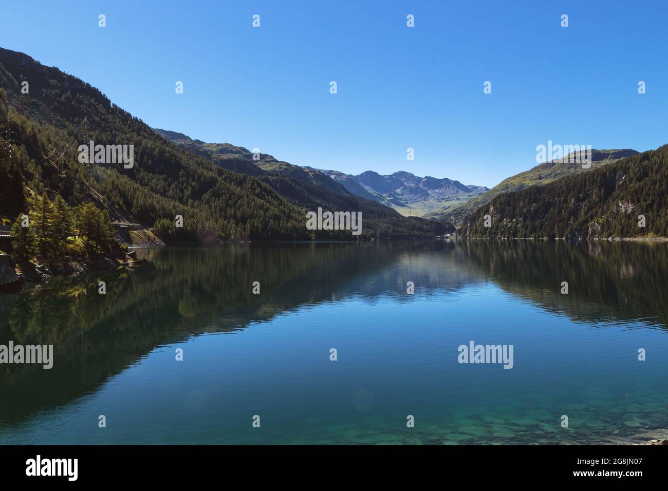 Marmorera lake on a bright summer day under clear blue sky. Julier pass, Grisons, Switzerland Stock Photo
