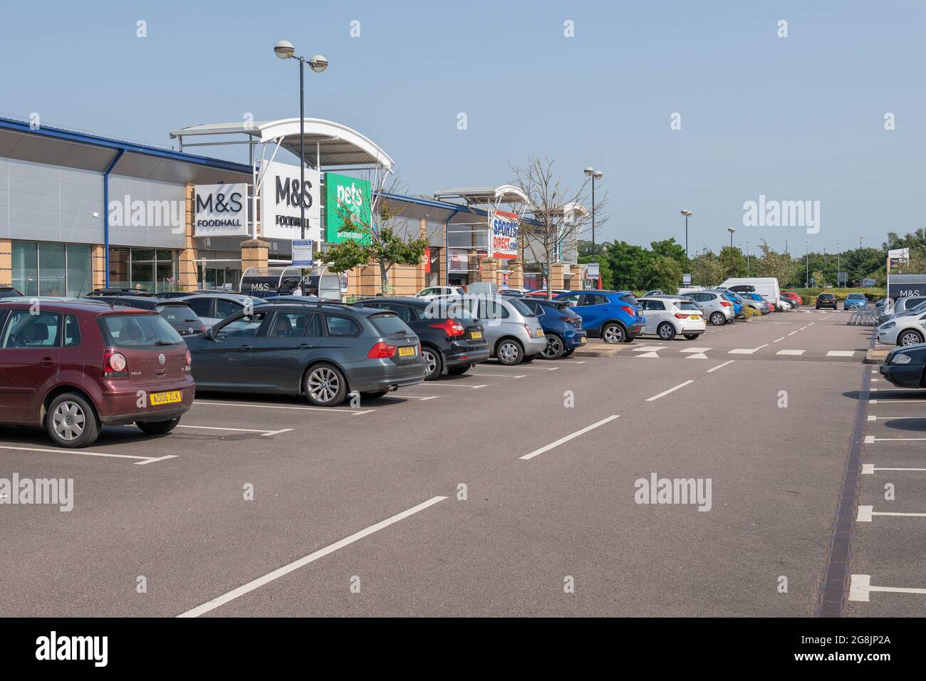 A view of Longwater retail car park with cars parked in allocated spaces Stock Photo