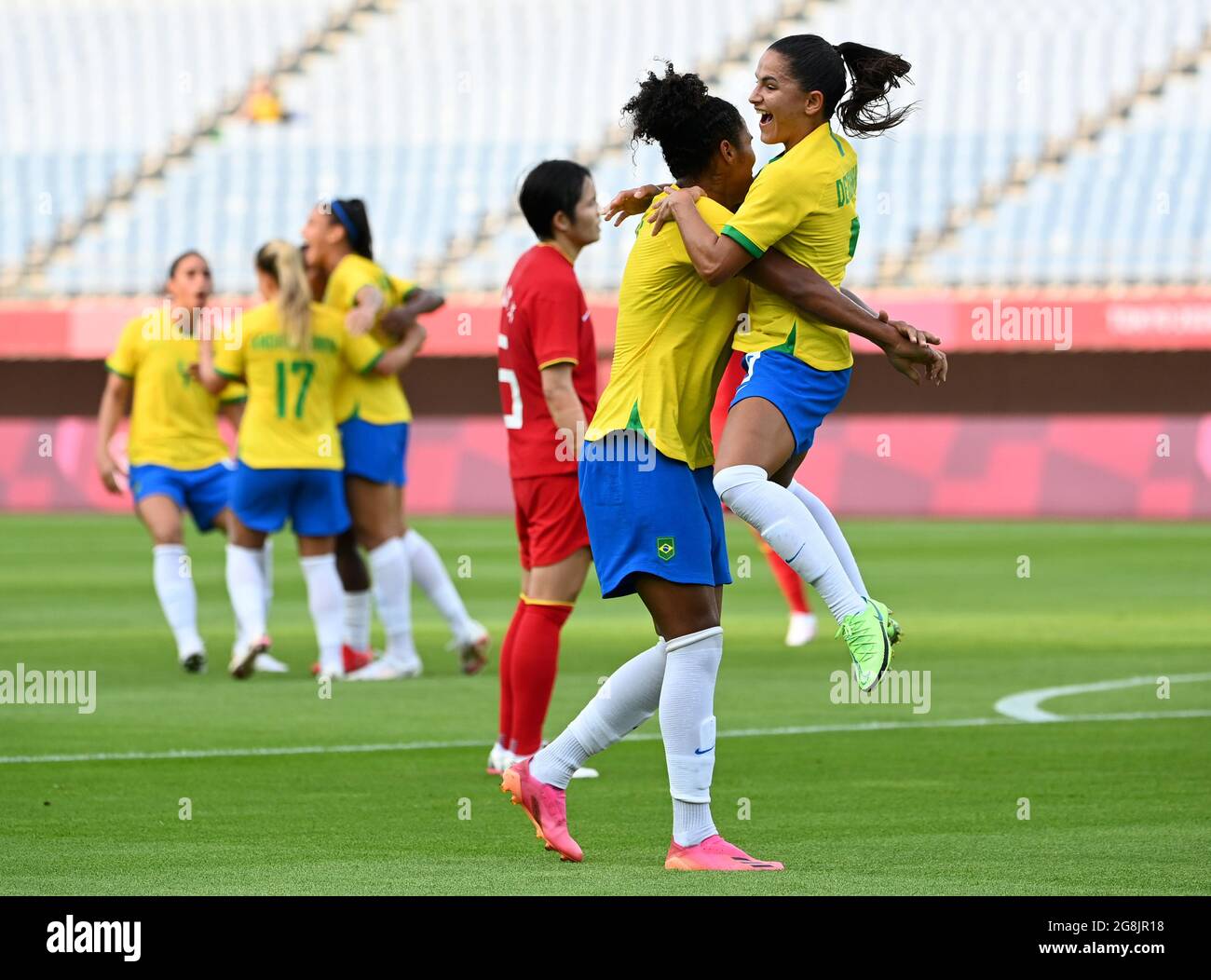 Tokyo, Japan. 21st July, 2021. Debinha (1st R) of Brazil celebrates ...