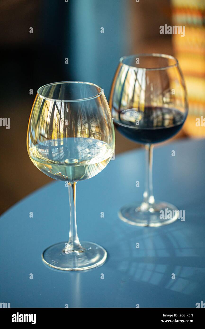 Two glasses of red and white wine in the restaurant Stock Photo
