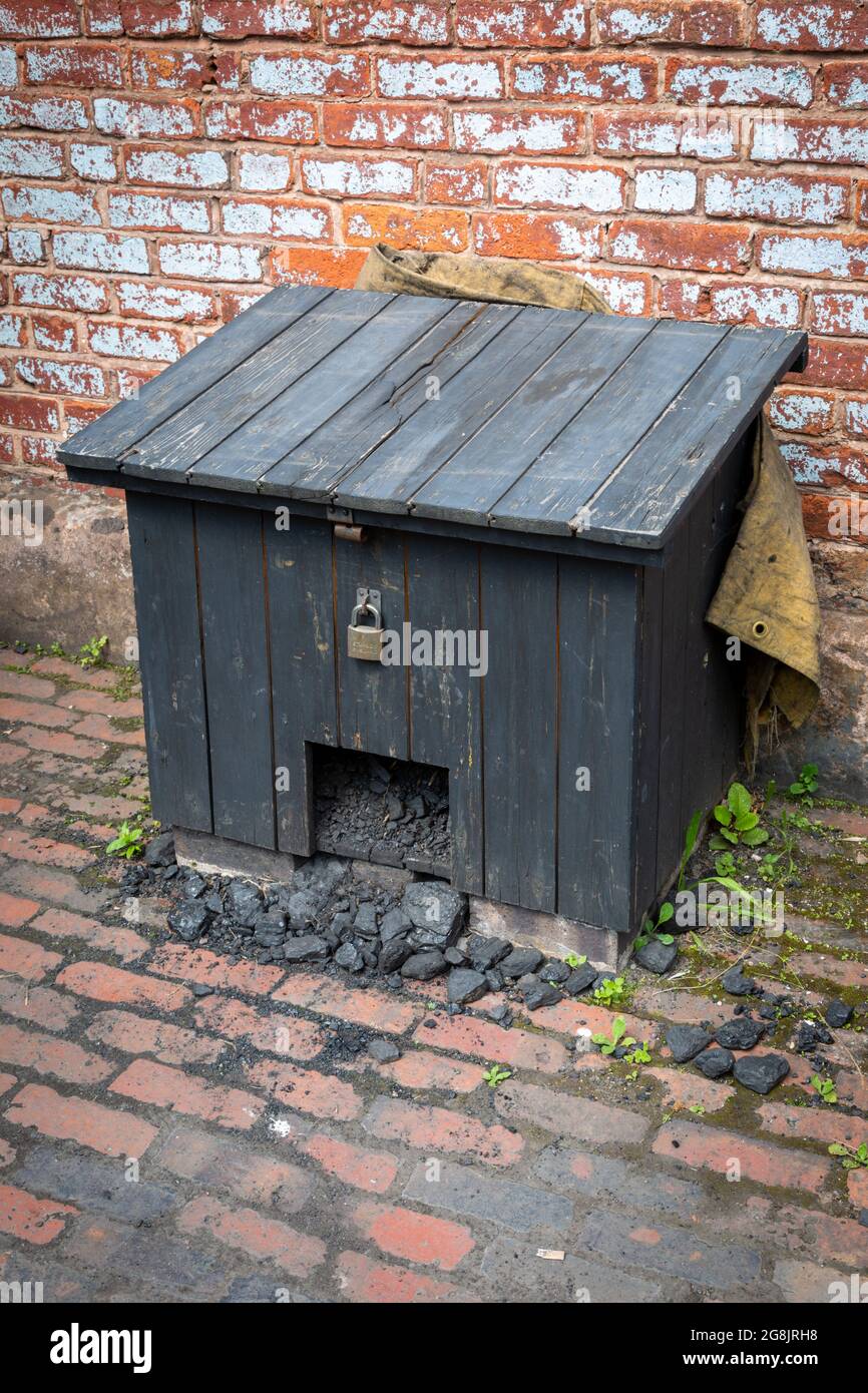 Old fashioned coalbunker or coal house outside a working class house